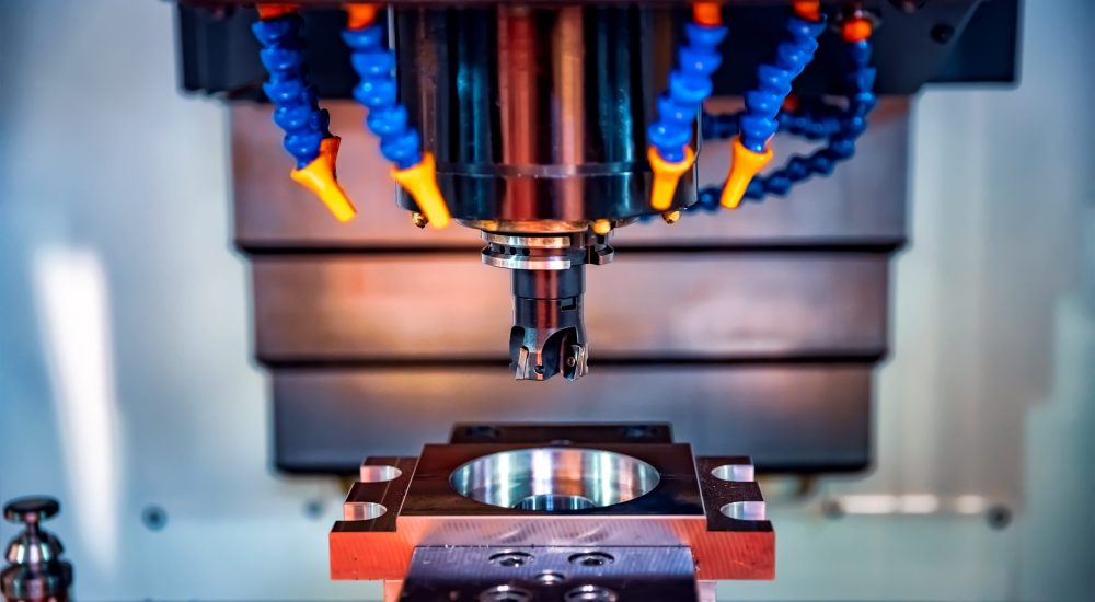 Metalworking CNC milling machine. Cutting metal modern processing technology. Small depth of field. Warning - authentic shooting in challenging conditions. A little bit grain and maybe blurred. Plastik Enjeksiyon Kalıp Üretimi CNC